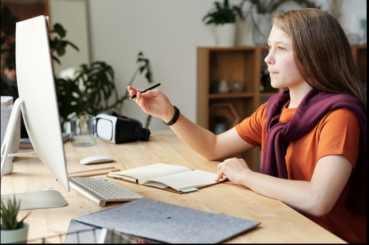 A student working through a lesson at a desk